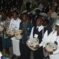 Ushers holding offering baskets