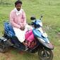 Mr Nagamanikam on his motorcycle