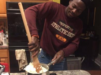 <p>Wyclif Ochieng makes Kenyan staple food ugali for his host IVEP family in Pennsylvania. </p>