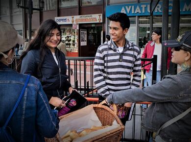 handing out bread to people on the street