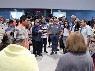 At Renewal 2027 in Costa Rica, Mennonites pray for migrants around the world. Photo: Henk Stenvers