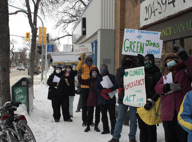 people gather outside a government office in winter weather